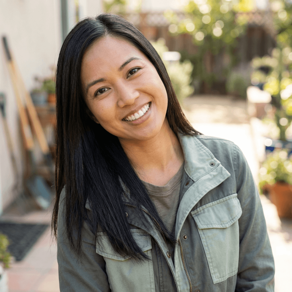 Margaret Chen, daughter of a senior care client, smiling warmly
