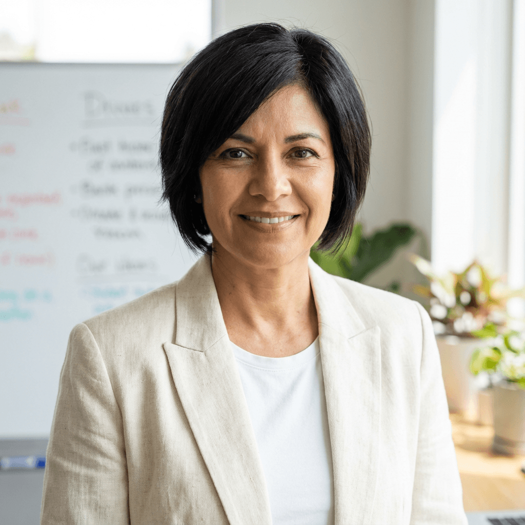 Elena Rodriguez, senior caregiver, with a caring and professional look in professional attire